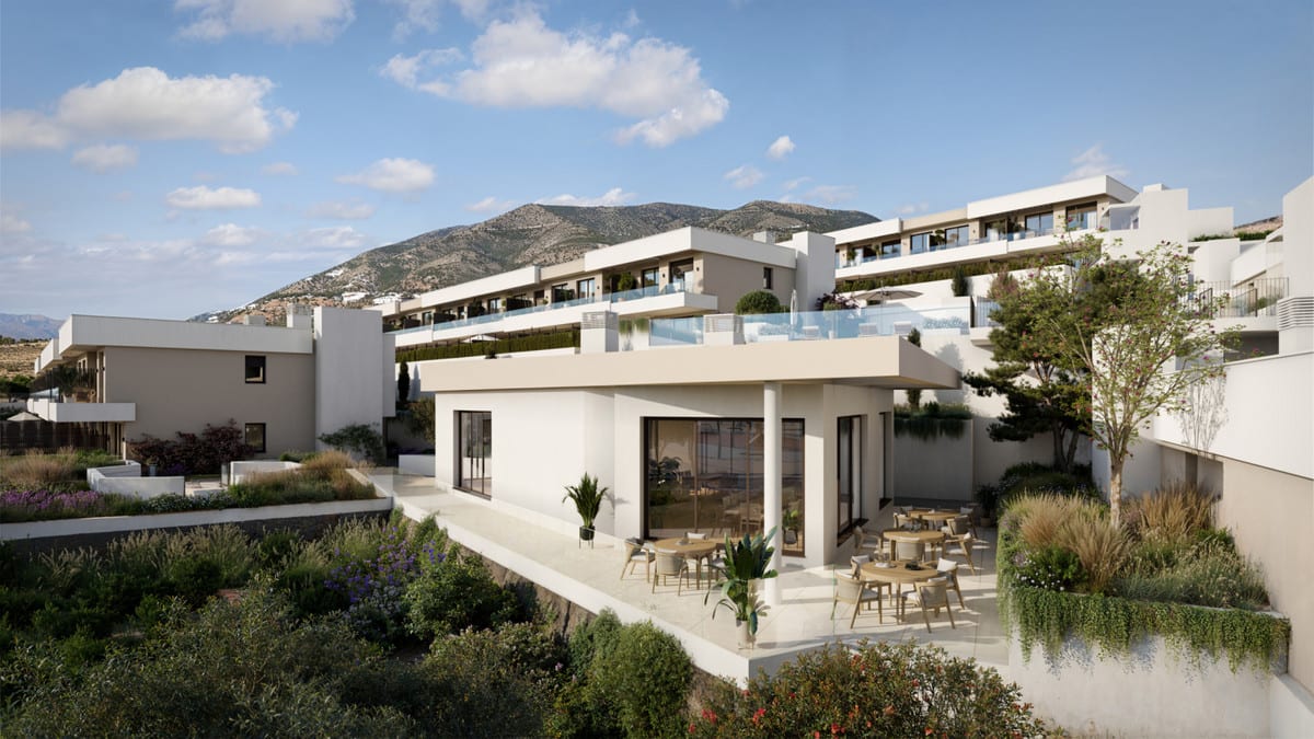 Rendered exterior of KALA RESIDENCES with a light-coloured terrace, round and rectangular outdoor tables with chairs, large sliding doors and lush surrounding planting.