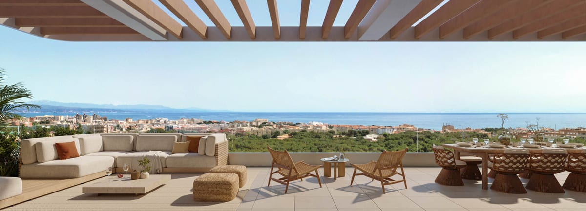 Project visualisation of KOSMOS with a covered terrace, wooden pergola, lounge area, dining table and views of buildings and water in the distance.