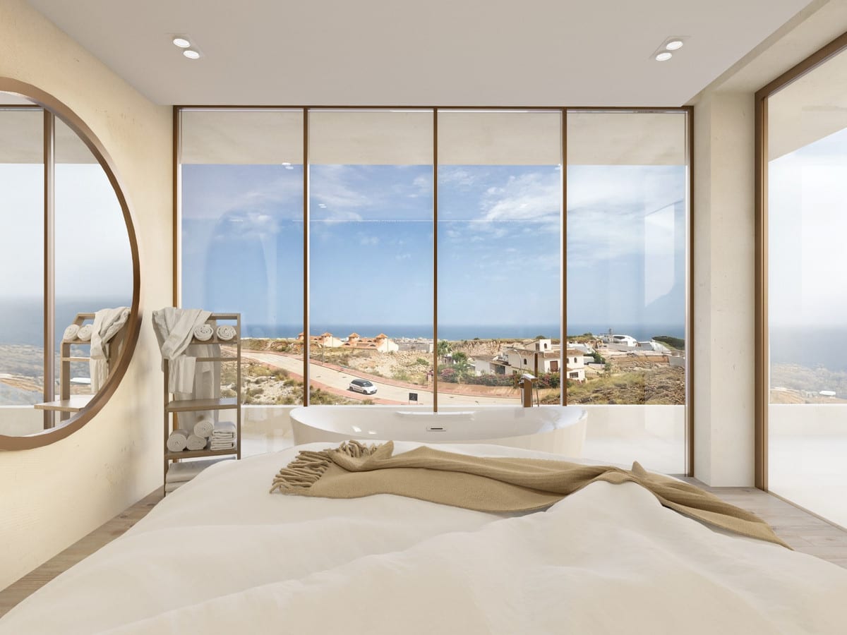 Bedroom visualisation with a freestanding bath beside large windows and views towards the sea.