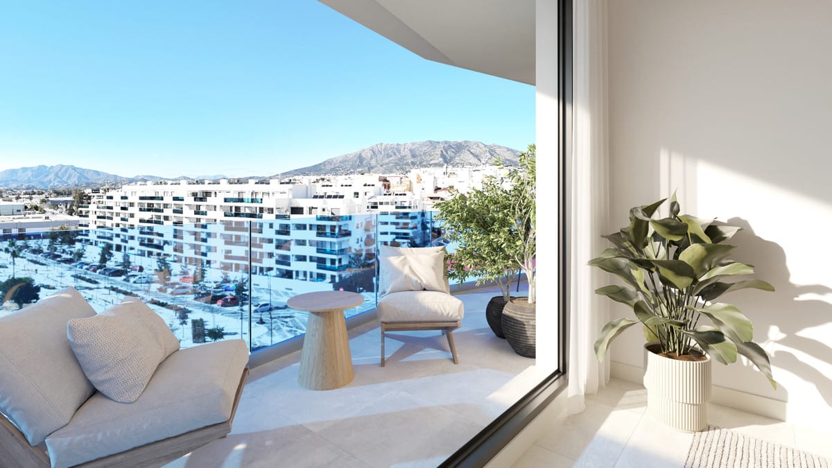 Rendered terrace visualisation of LAGUNA ONE with a glass railing, sofa, armchair, wooden side table and mountain scenery in the background.