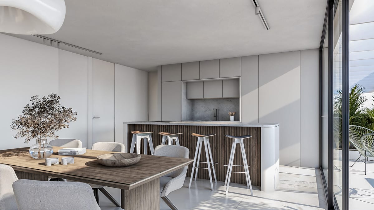 Project visualisation of LAS MESAS BLUE HORIZON featuring a wooden dining table, grey chairs, a kitchen island with dark fluted wood panelling, four bar stools and a light-grey wall of cabinetry, with sliding glass doors opening onto the terrace.