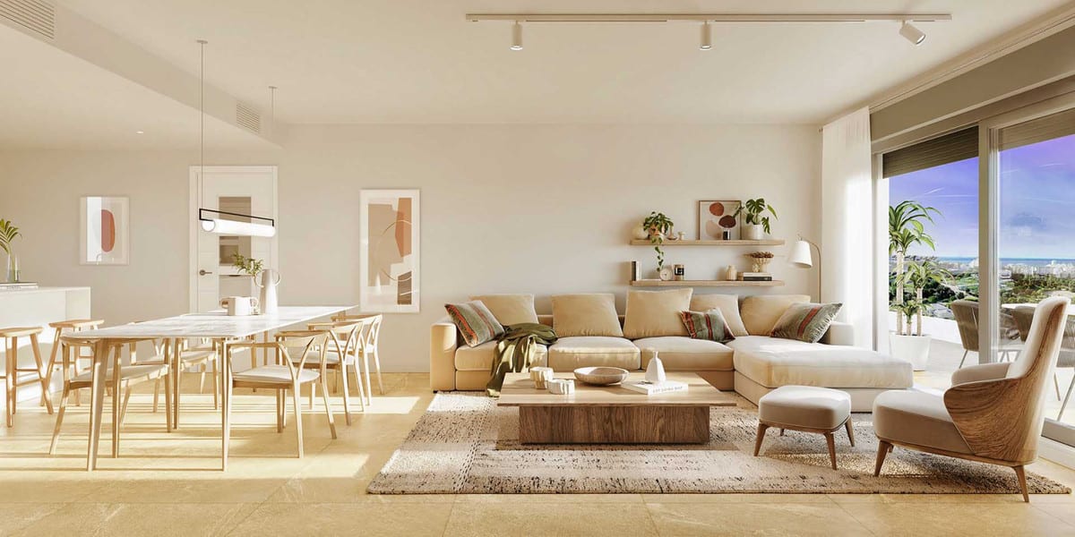 Project visualisation of LAS MESAS COLLECTION featuring a bright open-plan living and dining area, beige corner sofa, wooden dining table with chairs and sliding glass doors leading to the terrace.