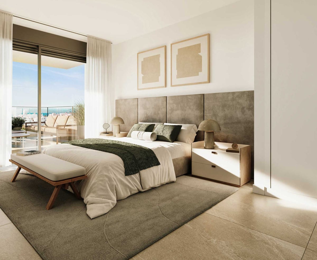 Project visualisation of LAS MESAS COLLECTION featuring a bedroom with a grey upholstered headboard, large double bed and sliding glass doors leading to a terrace with outdoor seating.