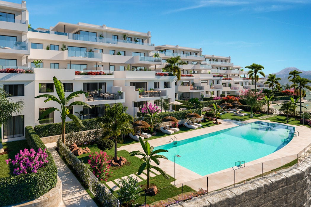 Project visualisation of LAS TERRAZAS DE CORTESIN BON AIR with several white storeys around a curved swimming pool, sun loungers, thatched parasols and tropical planting.