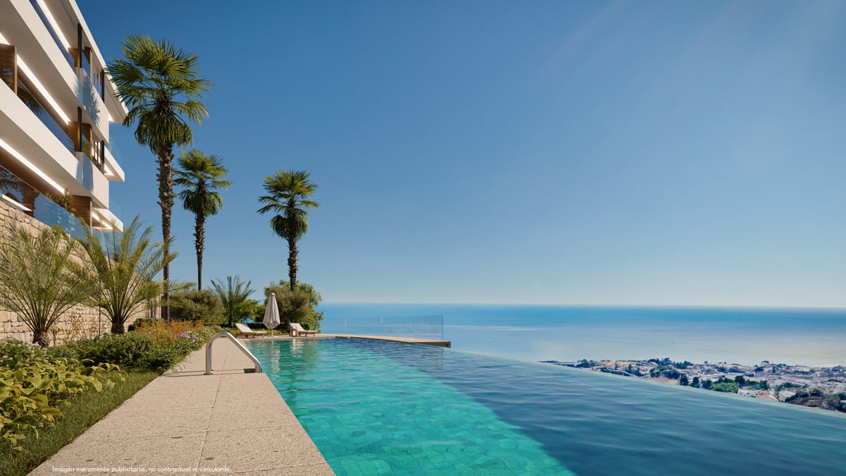 Project visualisation of LOMAS UNIQUE A with a long infinity pool, palm trees, two sun loungers with a parasol, lush planting and sweeping sea views in the background.