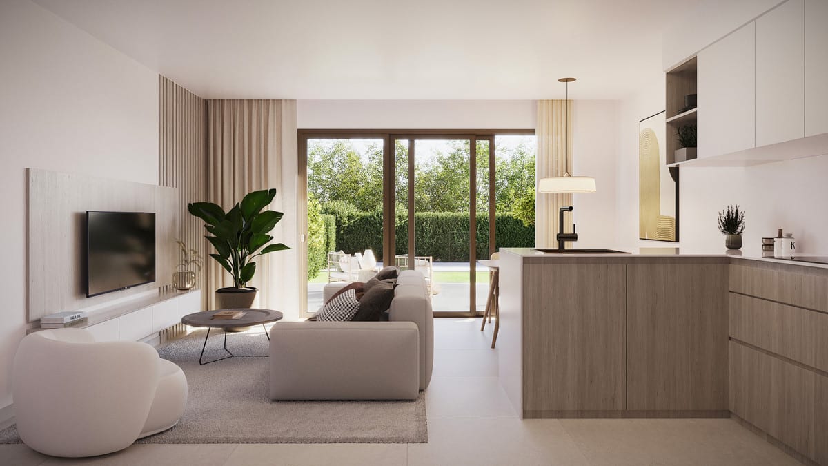 Interior project visualisation of LOOA ESTEPONA with an open-plan living space, wall-mounted television, light-coloured sofa, kitchen with wooden island and white upper cabinets, and large glass sliding doors leading to a green outdoor area.