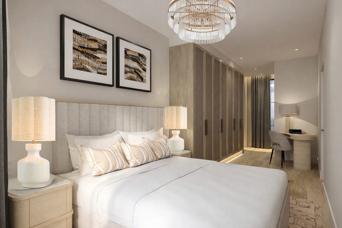 Project visualisation of LUNA NOVA RESIDENCES featuring a bedroom with a light upholstered headboard, double bed, fitted wooden wardrobes, two bedside tables with table lamps and a compact desk in the background.