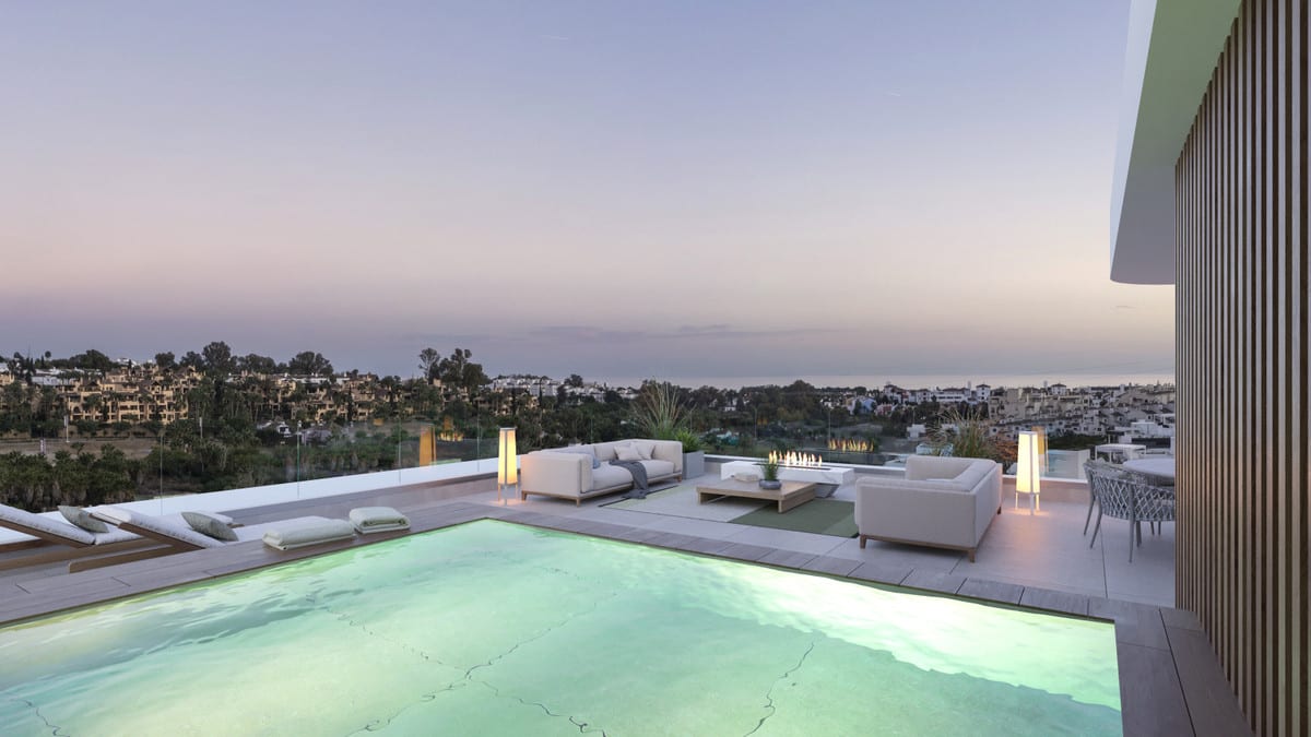 Project visualisation — LYRA RESIDENCES: Illuminated terrace pool with views towards the coast.
