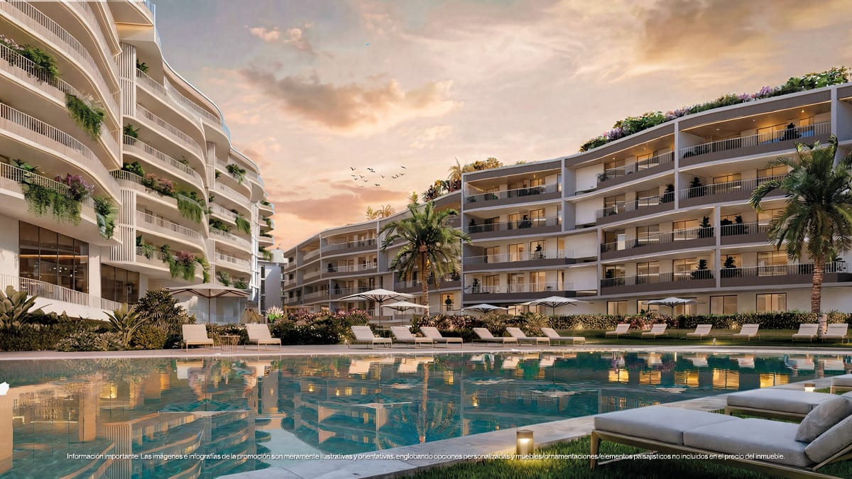 Project visualisation of MAGNA TORREMOLINOS with a swimming pool, sun loungers, planted balconies and two building wings around a green courtyard at dusk.