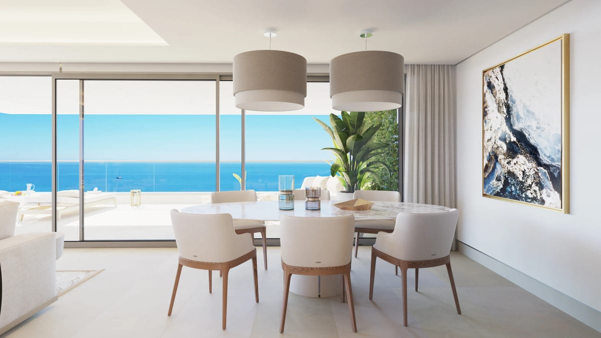 Project visualisation — MALAGA TOWERS: Dining area with a round table, six chairs and two pendant lights beside the terrace doors.
