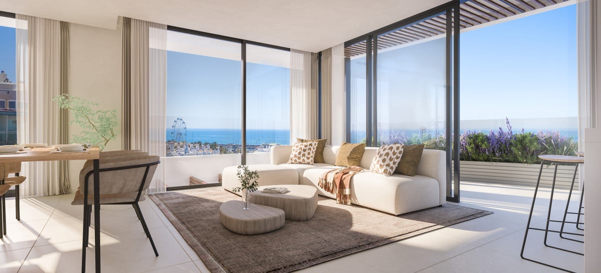 Project visualisation of MARINA GOLDEN BAY featuring a bright living room, round coffee tables, a cream corner sofa, a dining area on the left, ceramic flooring, large sliding glass doors and a terrace with a planter and sea views.