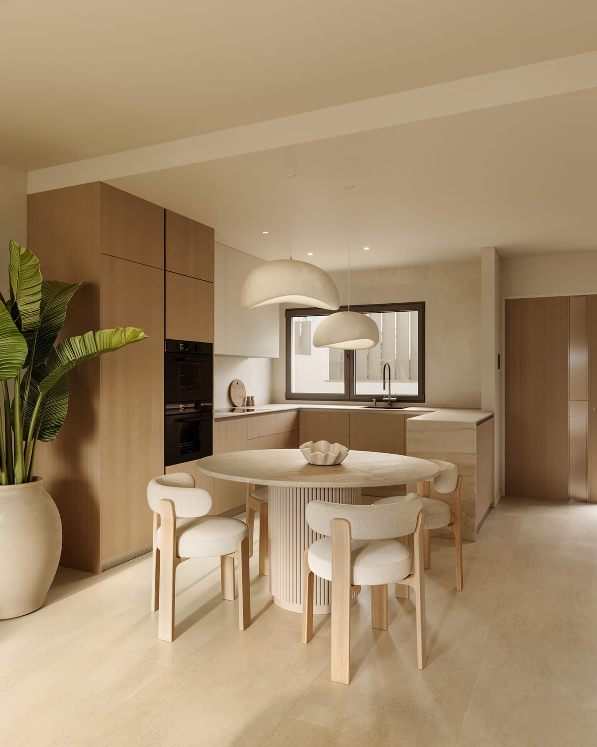 Project visualisation of MARTAGINA HILLS featuring a kitchen and dining area: tall light-wood cabinets, an integrated dark oven, light worktops, a round dining table with cream bouclé chairs, two large dome pendant lights and a large houseplant in a round pot.