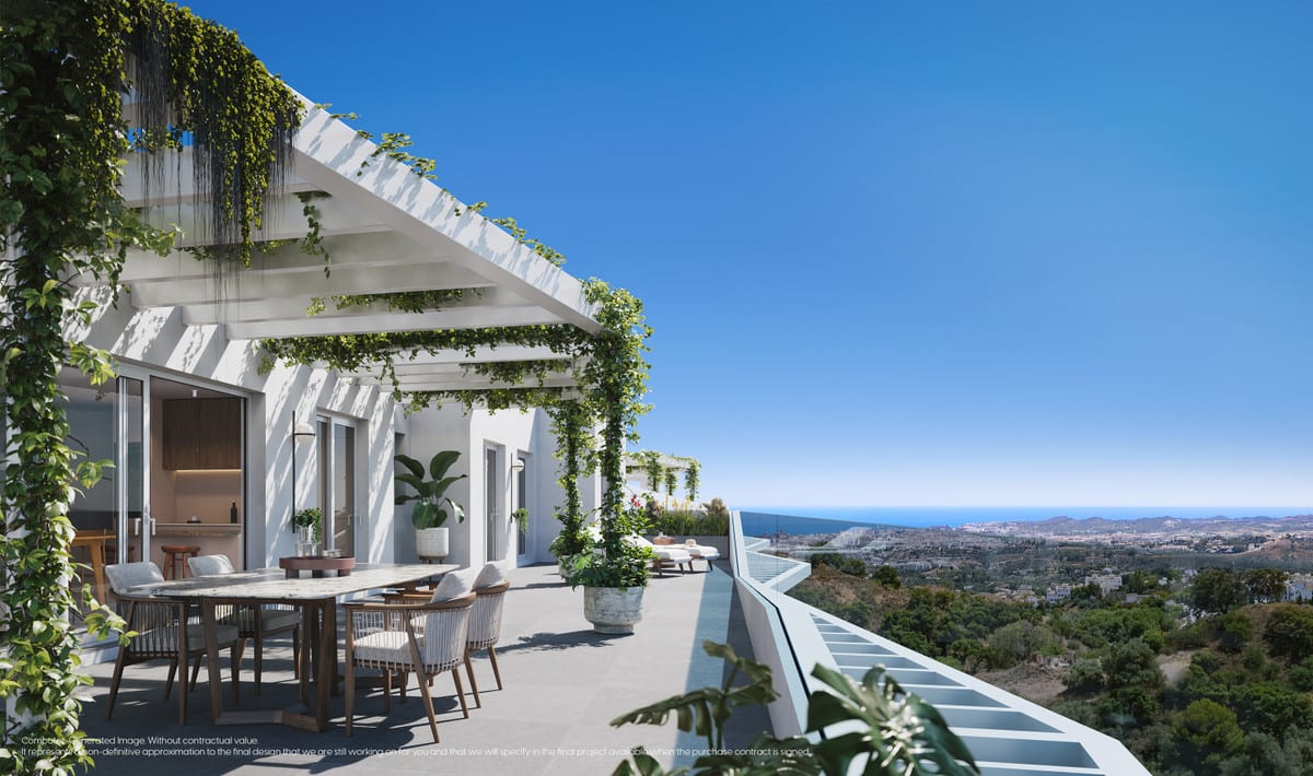 Project visualisation of MIJAS SEAVIEWS with a terrace with a pergola, a light dining table with chairs, climbing plants along white concrete beams, a glass balustrade and wide views over hills and a body of water on the horizon.