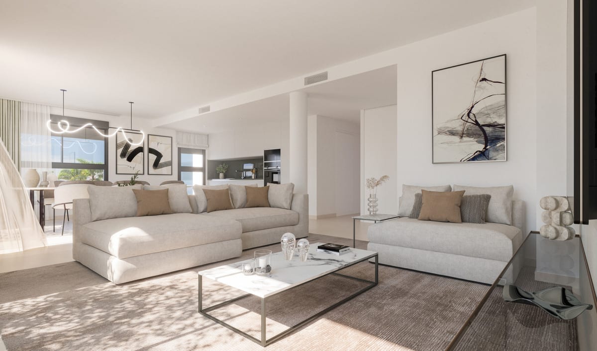 Development visualisation of NATURA ESTEPONA with two light beige sofas, a pale coffee table, rug, abstract wall art, sculptural pendant light and an open connection to the dining area and kitchen.