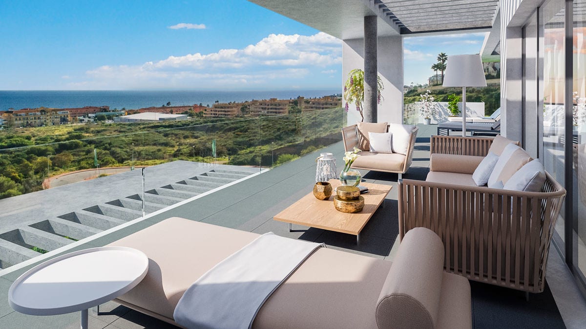 Development visualisation of NAVIGOLF SUITES featuring a terrace with wooden seating, a sun lounger, glass balustrade and views of the sea and green surroundings.