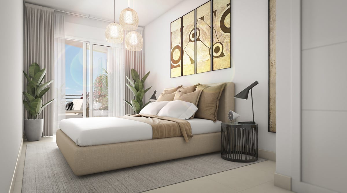 Project visualisation of NEXUS RESIDENCES with a bedroom, beige upholstered double bed, three rattan pendant lights, four pieces of wall art, a dark round bedside table with table lamp and a door leading outside.