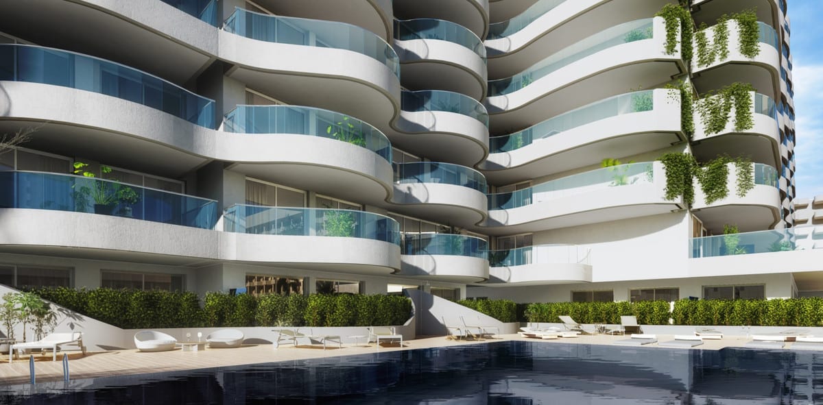 Project visualisation of NOVA MARINA with a dark blue swimming pool, wooden terrace, white loungers, green hedges and curved balconies with glass balustrades.