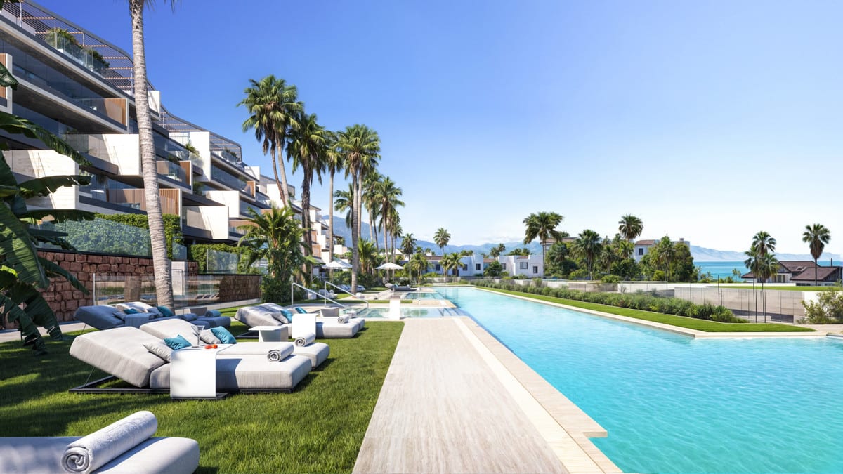 Rendered sun loungers beside the pool, surrounded by palms and greenery.