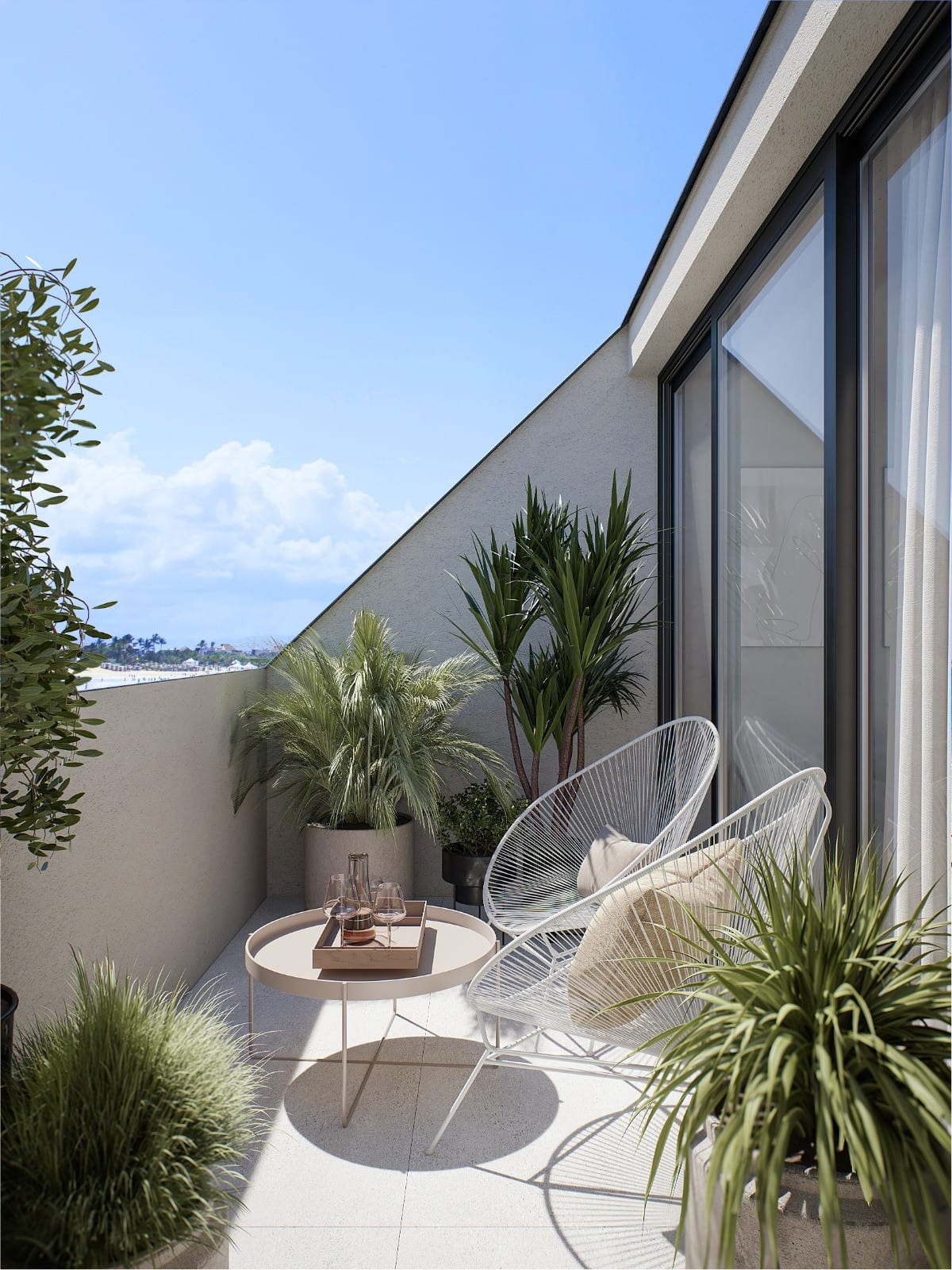 Project visualisation of PELIT MARITIMO with a narrow terrace featuring two white Acapulco-style chairs, a round pink side table with a tray, pale tiled flooring and several potted plants including palms and grasses.