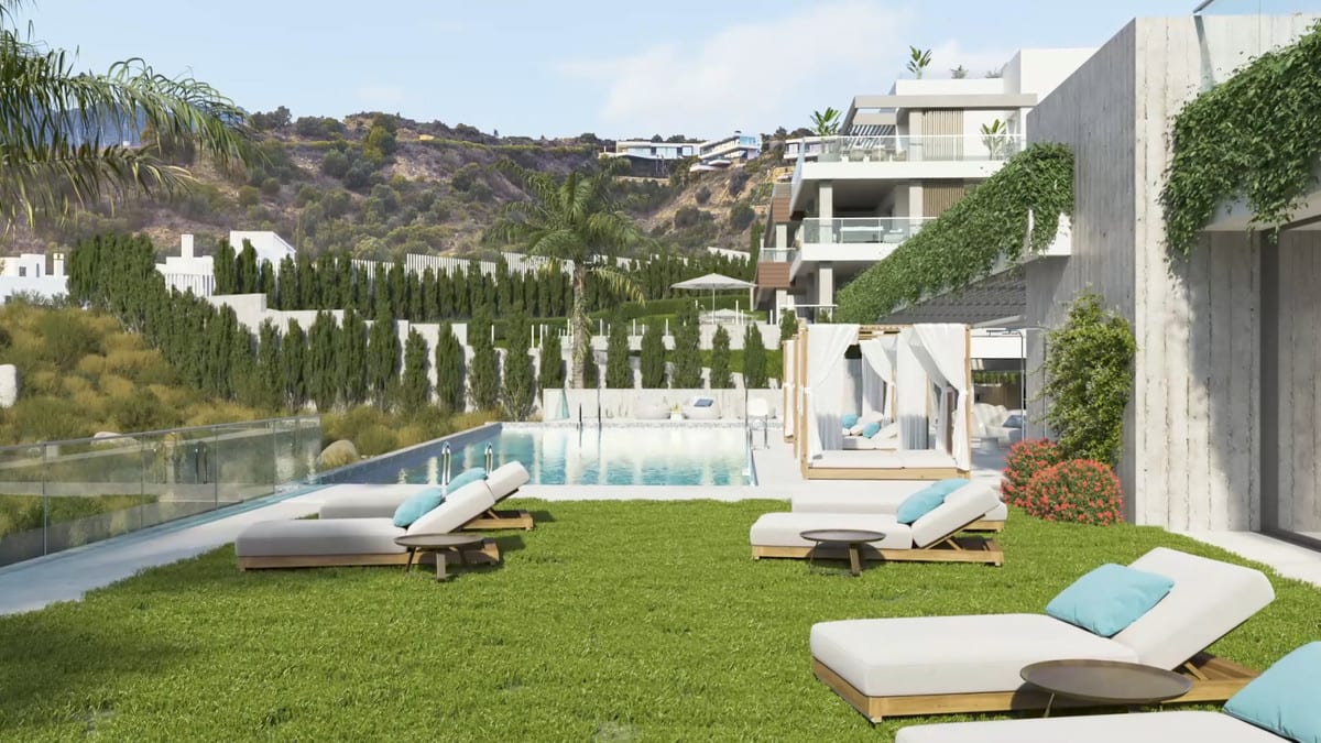 Project visualisation of QUINTESSENCE with sun loungers on grass, a swimming pool, a cabana with white curtains and planted concrete walls.