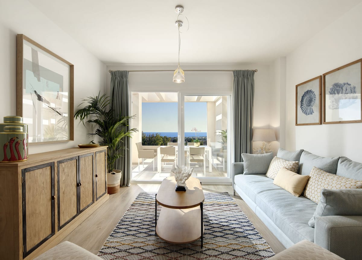 Living room at RESIDENCIAL ALBATROS XV with a light-grey fabric sofa, wooden sideboard, geometric rug, round coffee table and sliding glass door to a sunny terrace with dining furniture.