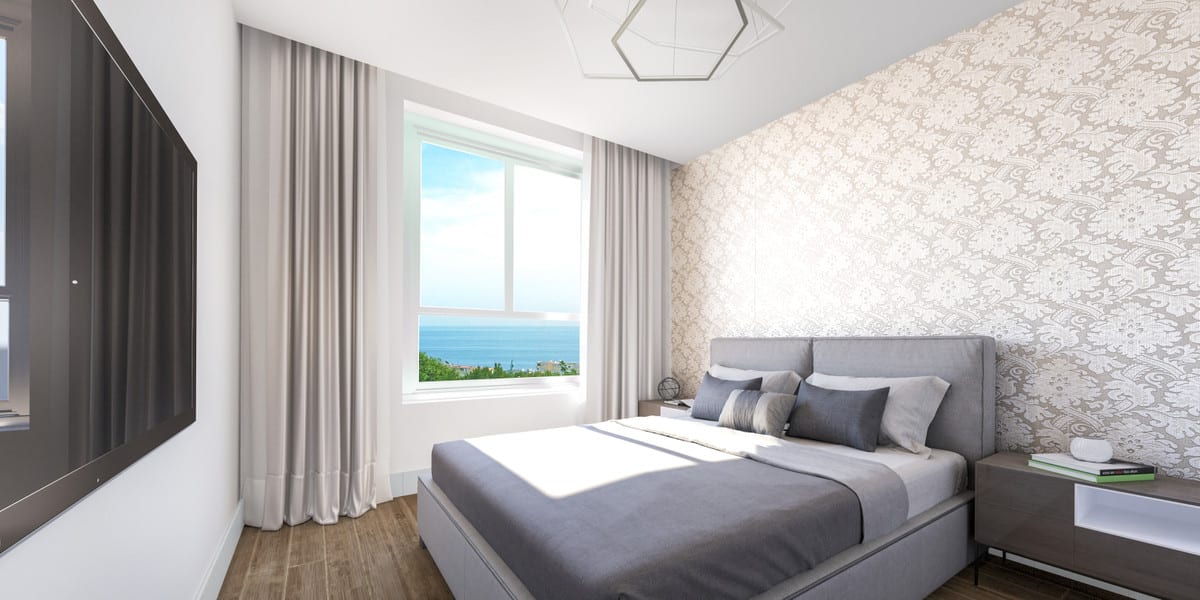 Project visualisation of RESIDENCIAL PACARAIMA featuring a bedroom, grey upholstered bed, bedside table and window with sea views.