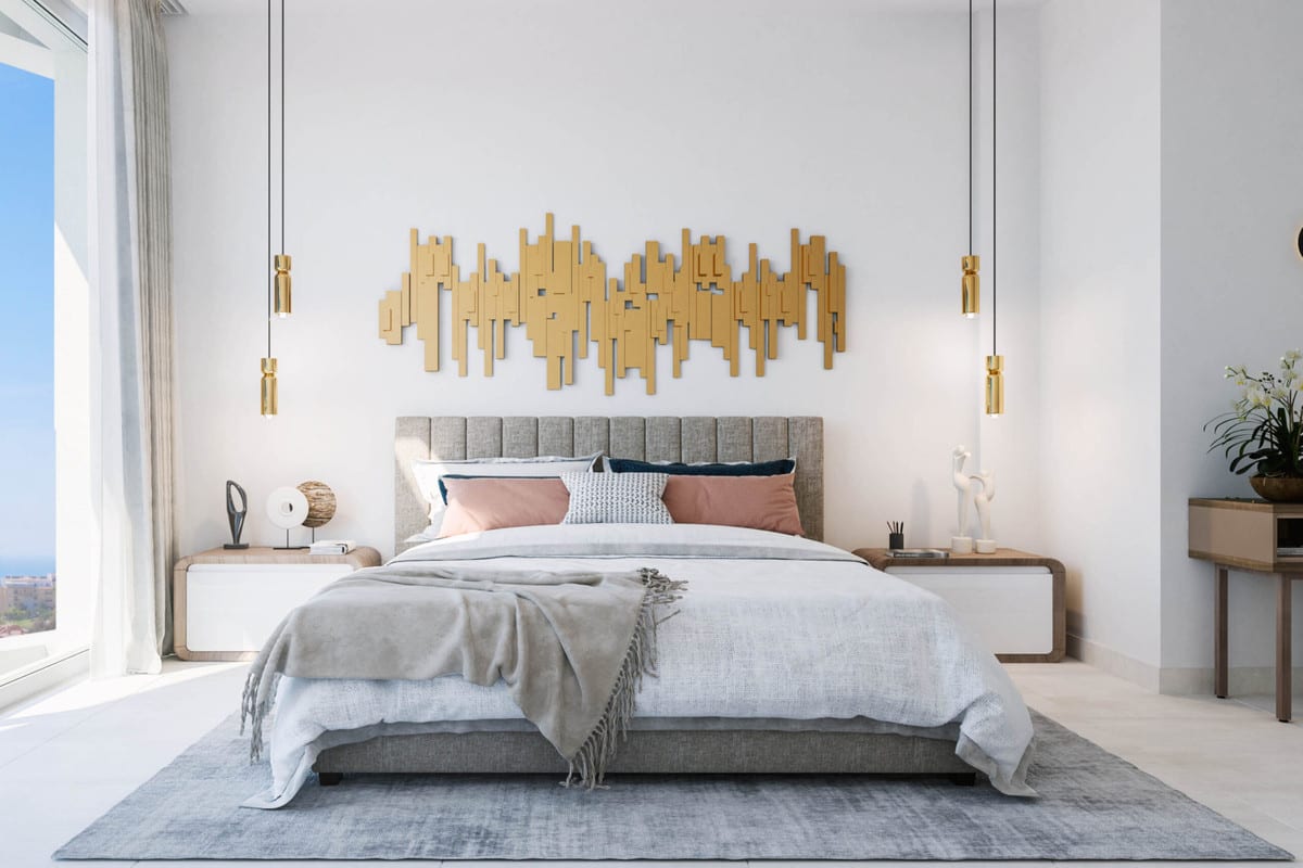 Project visualisation of ROYAL PALMS MIJAS featuring a bedroom with an upholstered bed, gold wall decoration, bedside tables, dressing table and a large window with sea views.