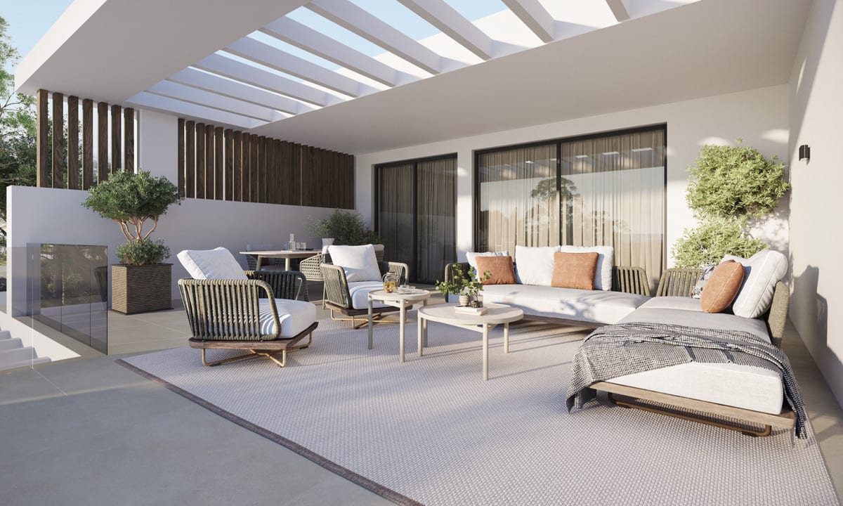 Rendered furnished terrace beneath a white pergola with lounge seating and a sun lounger.