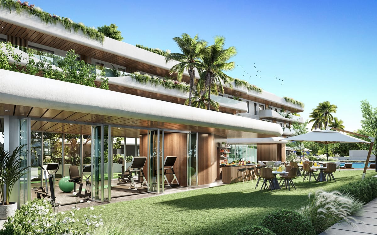 Project visualisation of SALVIA II featuring a glass-walled fitness room with exercise equipment, an adjoining wooden bar with bar stools and food, and outdoor dining tables with chairs on the lawn beside a swimming pool in the background.