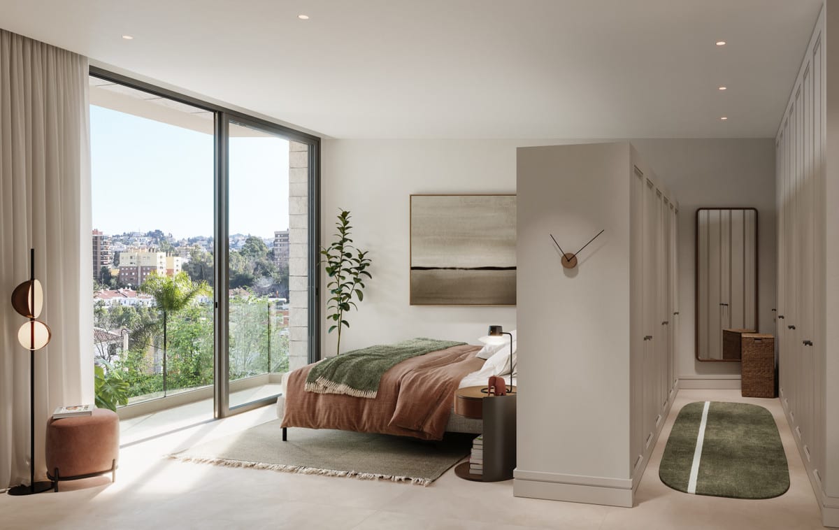 Quiet bedroom with a wardrobe, seating pouf, and a large glass sliding door overlooking greenery and buildings.