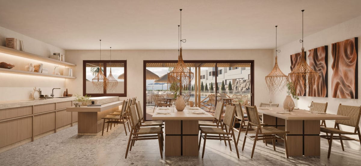 Rendered interior visualisation of SAVIA - FASE 2 with an open-plan kitchen along the wall, two wooden dining tables, woven pendant lights and sliding doors opening onto a terrace.