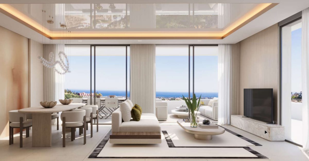 Project visualisation of SENORA GARDENS featuring a bright living and dining area, a glossy indirectly lit ceiling, sliding glass doors and sea views visible through the glass.