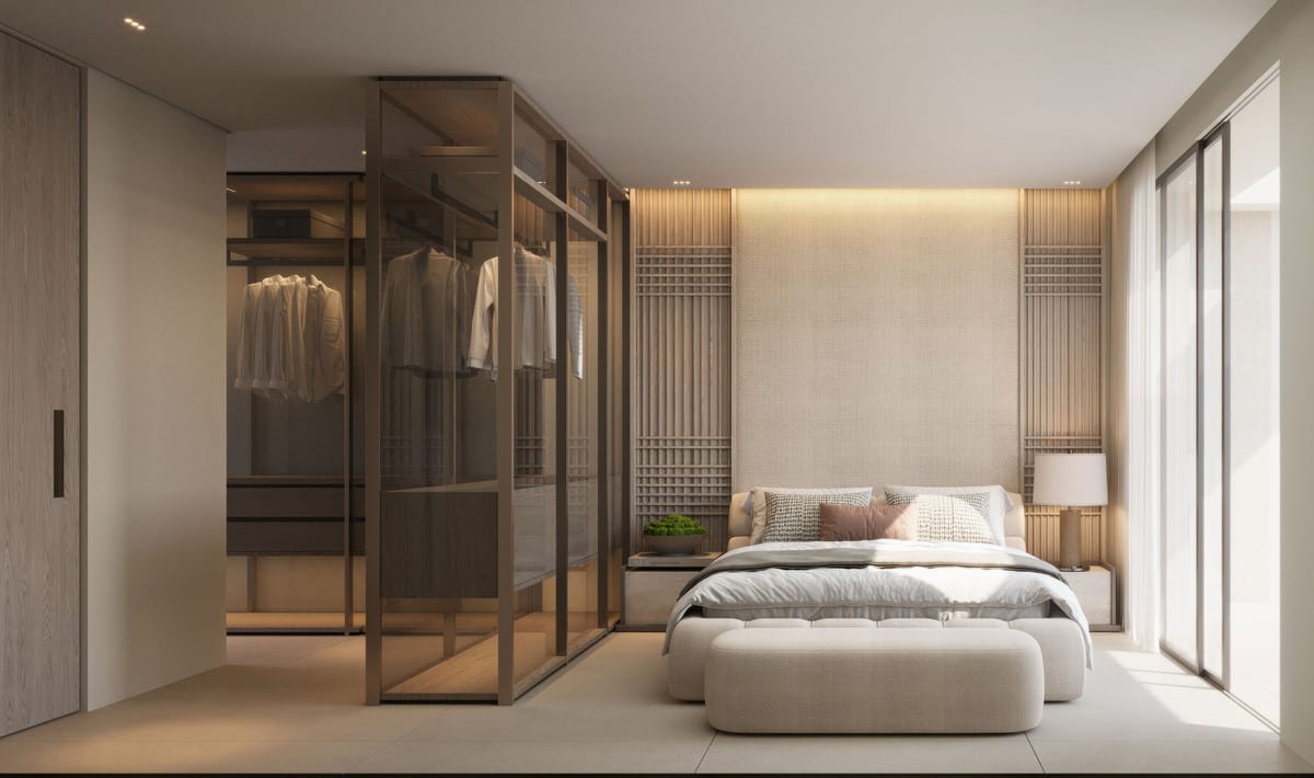 Project visualisation of SENORA GARDENS featuring a bedroom, an upholstered bed with textured headboard panels, an ottoman, a bedside table with lamp and a walk-in wardrobe with bronze glass doors.