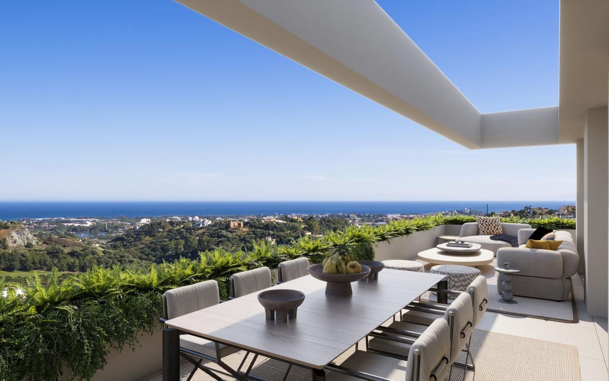 Project visualisation of SENORA GARDENS featuring a terrace, dining table with chairs, lounge seating, ferns along the balustrade and wide views over greenery and the sea.