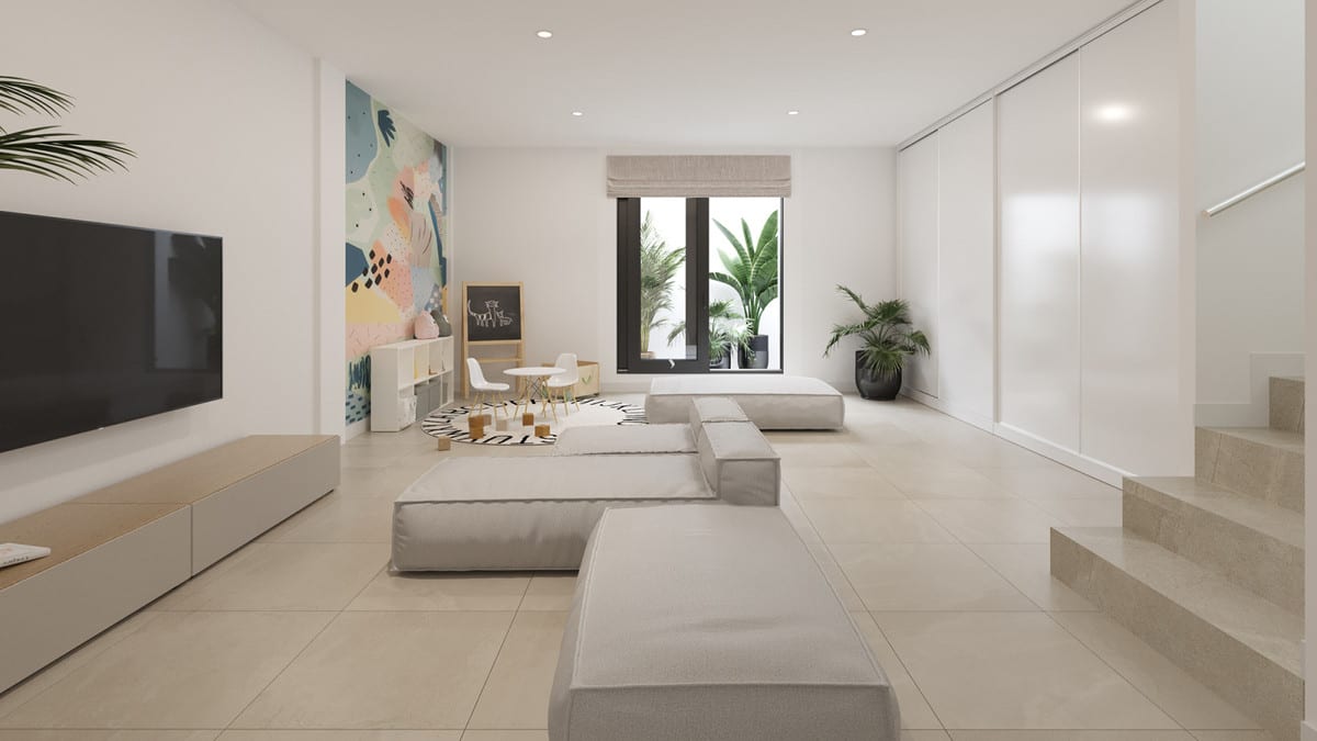Rendered interior visualisation of SERENE ATALAYA - PHASE 1 with grey floor cushions, wall-mounted television on a low wooden unit, colourful abstract wall mural, play area with children's table and blackboard, window with blind and staircase.