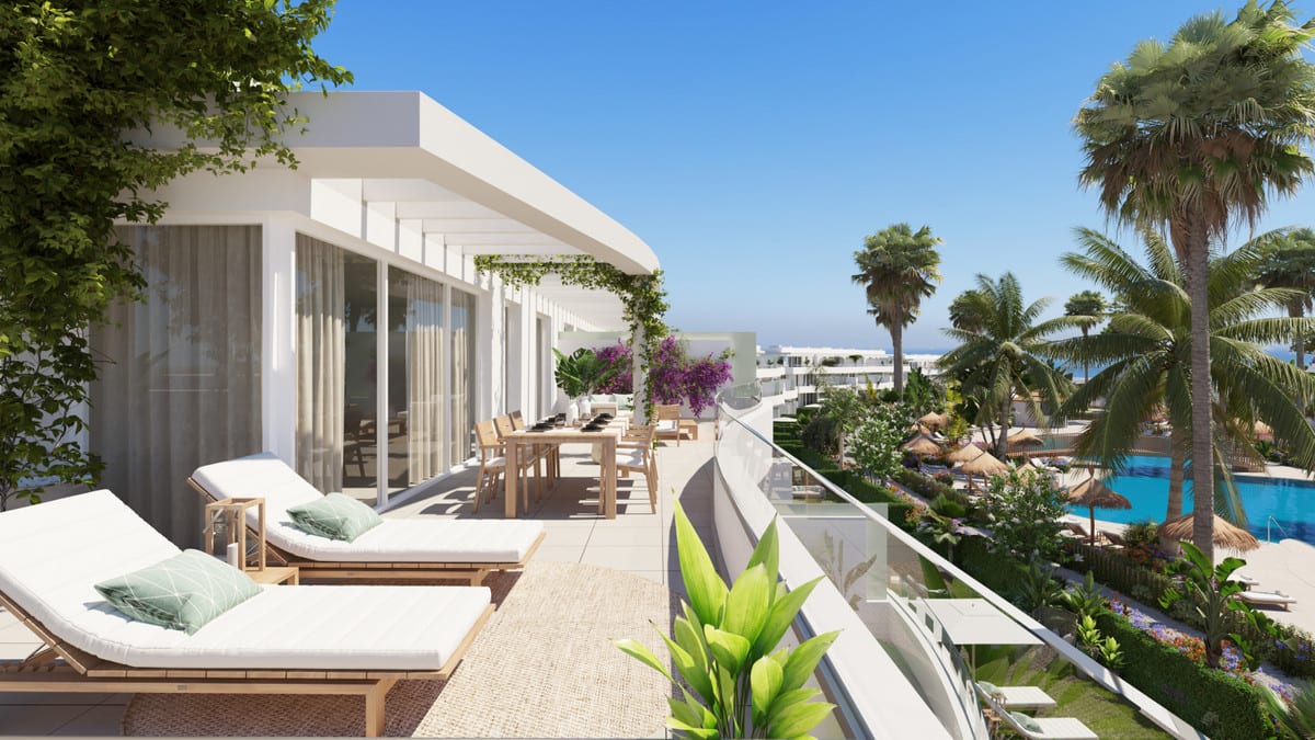 Development visualisation of SERENITY FRONTLINE GOLF HOMES AND BEACH CLUB featuring a spacious terrace with two sun loungers, a wooden dining table, glass balustrade, sliding doors and views of the pool area.