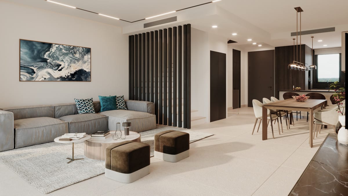 Rendered interior visualisation of SERENITY HILLS with a grey L-shaped sofa with teal cushions, brown velvet ottomans, a round layered coffee table, a dark vertical slatted room divider, a wooden dining table with chairs and dark kitchen cabinets in the background.