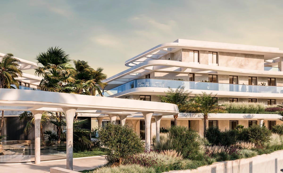 Project visualisation of SOLAIA featuring a light-coloured building, flowing horizontal rooflines, glass balcony balustrades, round columns and lush planting including palm trees and lavender.