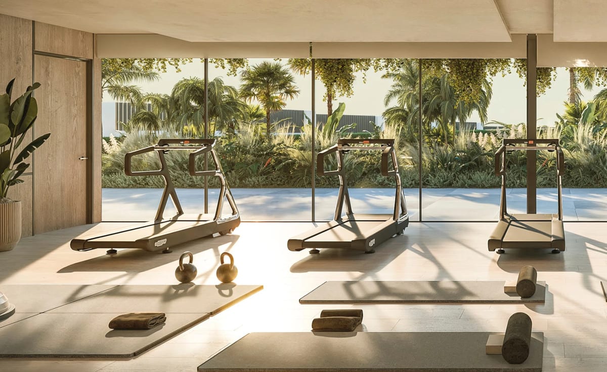 Project visualisation of SOLAIA featuring three treadmills, exercise mats, foam rollers, kettlebells and towels on a light floor in front of floor-to-ceiling glass walls overlooking tropical planting.