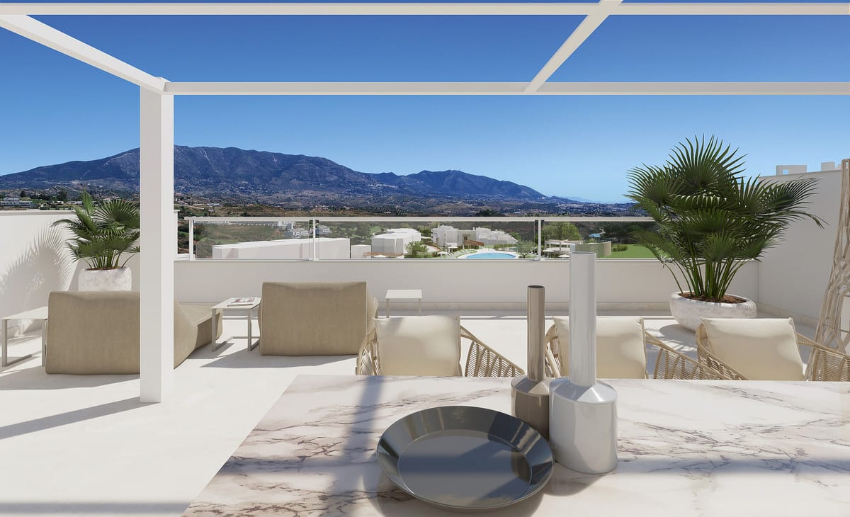 Project visualisation of SOLANA VILLAGE featuring a terrace beneath a white pergola, a marble-look table, lounge seating, palm planting, a glass balustrade and a mountain panorama.
