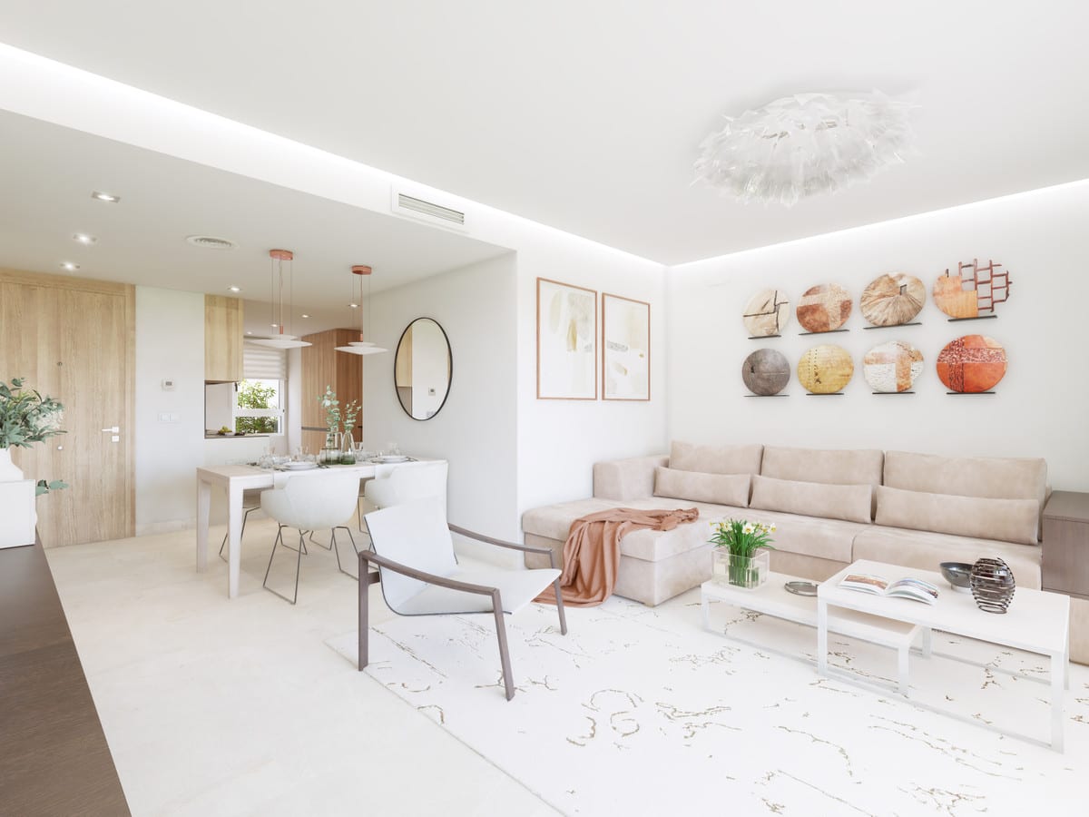 Project visualisation of SOLANA VILLAGE featuring a bright living space, beige corner sofa, white coffee table, dining table, wood-look doors and decorative circular wall art.