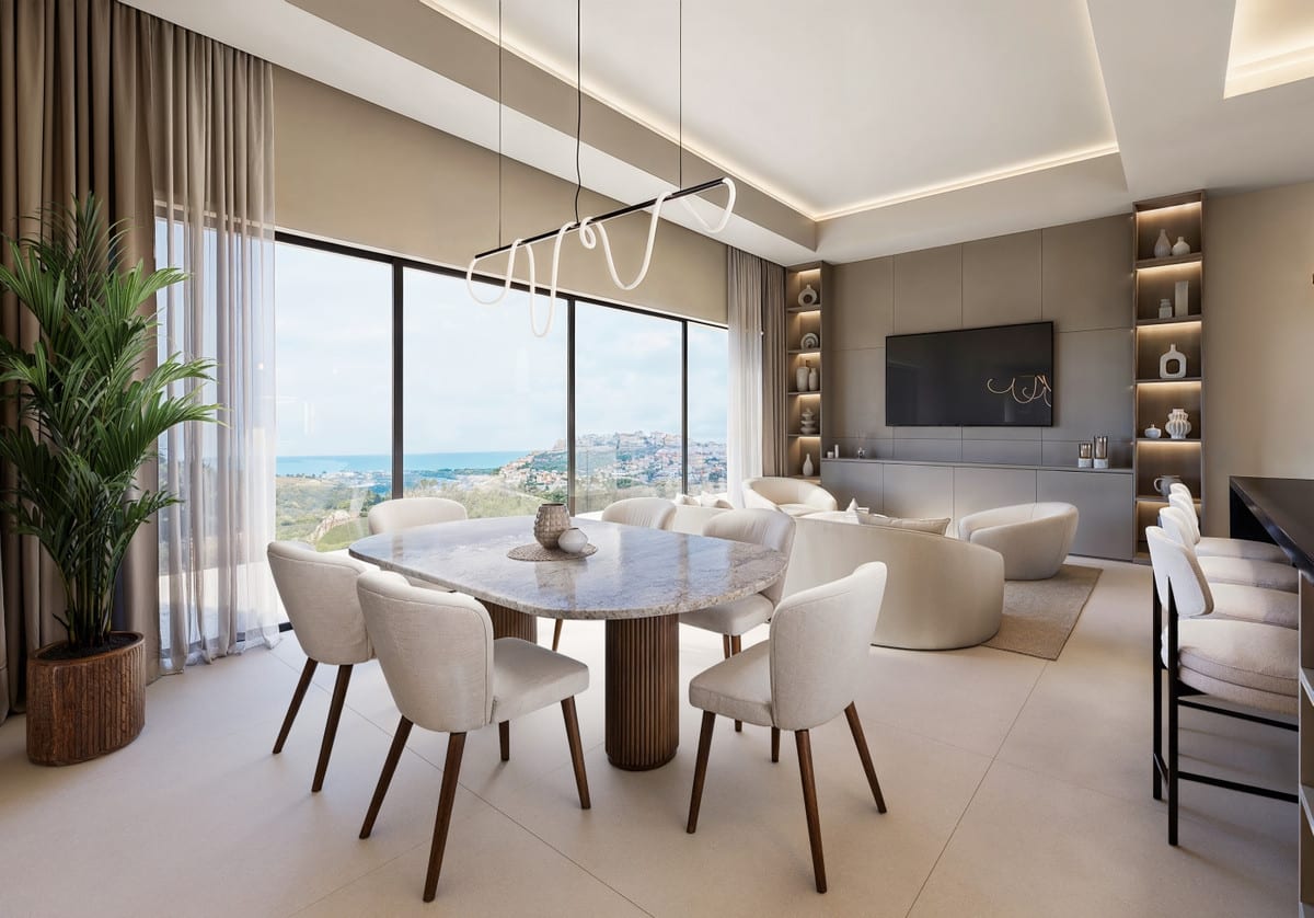 Rendered living space with an oval dining table in the foreground, a built-in wall unit with television and large windows with sea views.