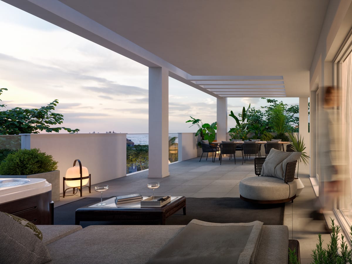 Project visualisation of STELLA 8 with a covered terrace at dusk, seating area, rectangular coffee table, dining table, hot tub and white parapet with tropical planting.