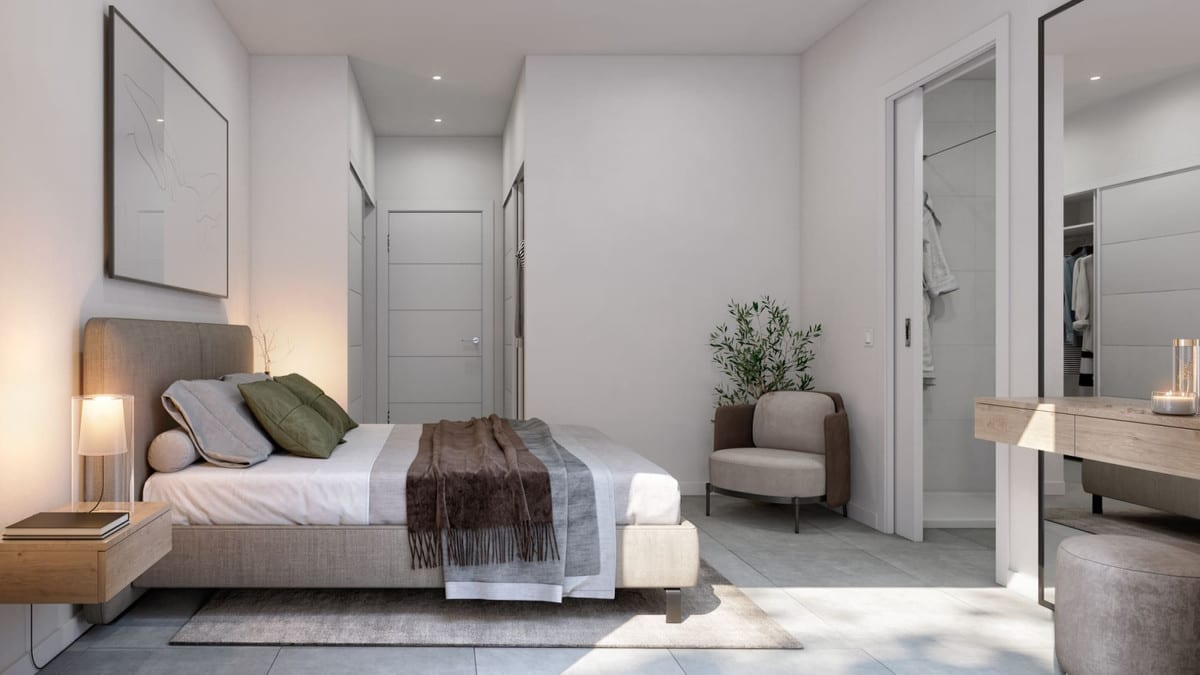 Project visualisation of STELLA 8 with a bedroom, upholstered bed, wooden bedside table, armchair, mirror and open passage to a walk-in wardrobe.