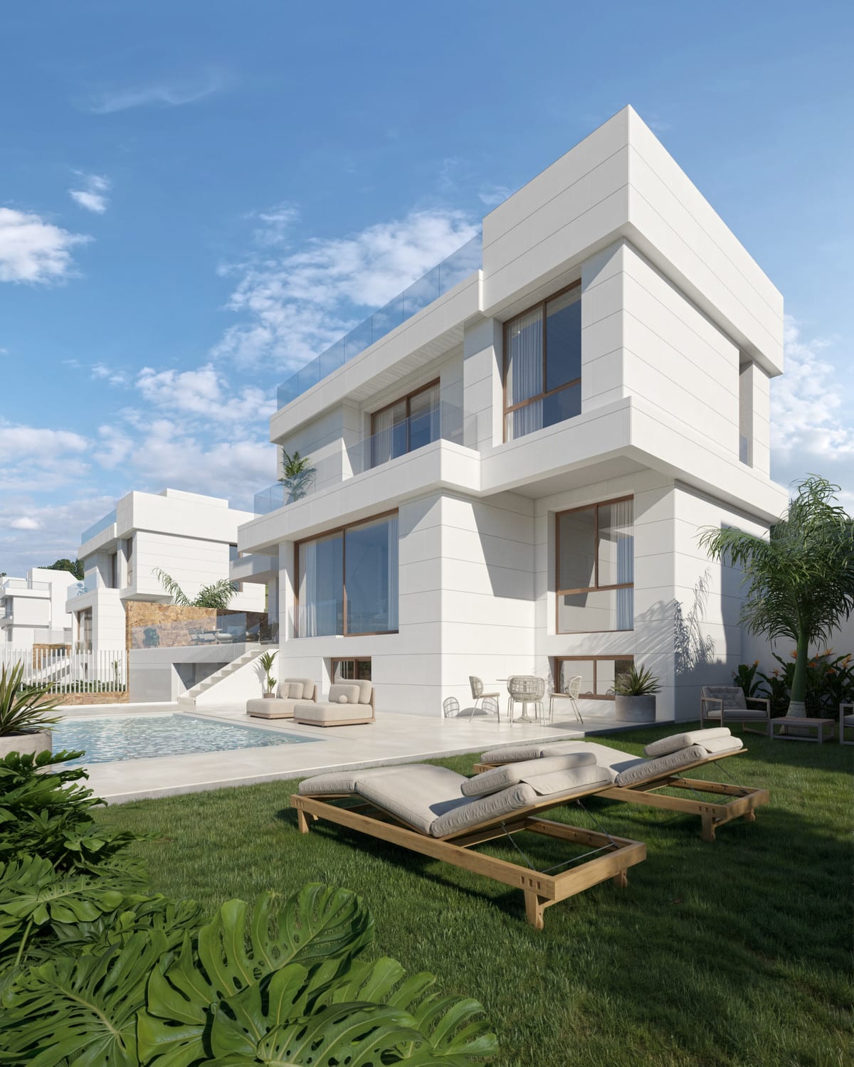Project visualisation of SWING AND SEA VILLAS with a white three-storey home, a swimming pool on the terrace, two wooden sun loungers on a lawn and large sliding doors with bronze frames.