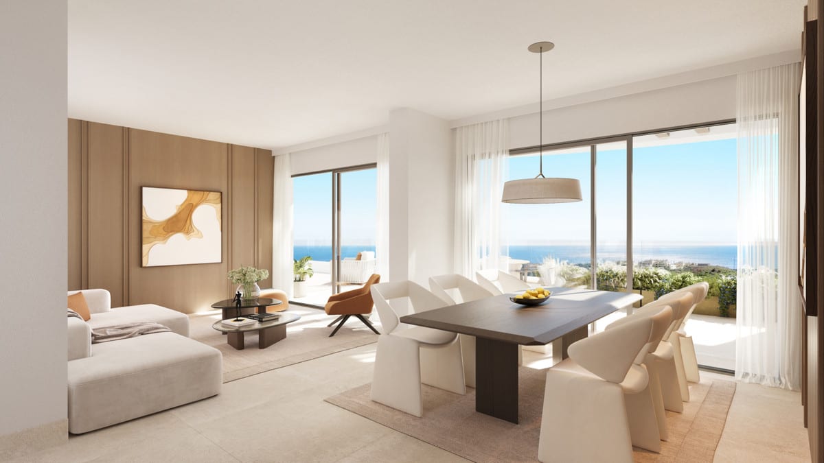 Project visualisation of the living and dining area at THE EAGLE RESIDENCES with a dark dining table, white chairs, white sofa, wooden wall panelling, pendant light and two large sliding glass doors with a rendered sea horizon in the background.