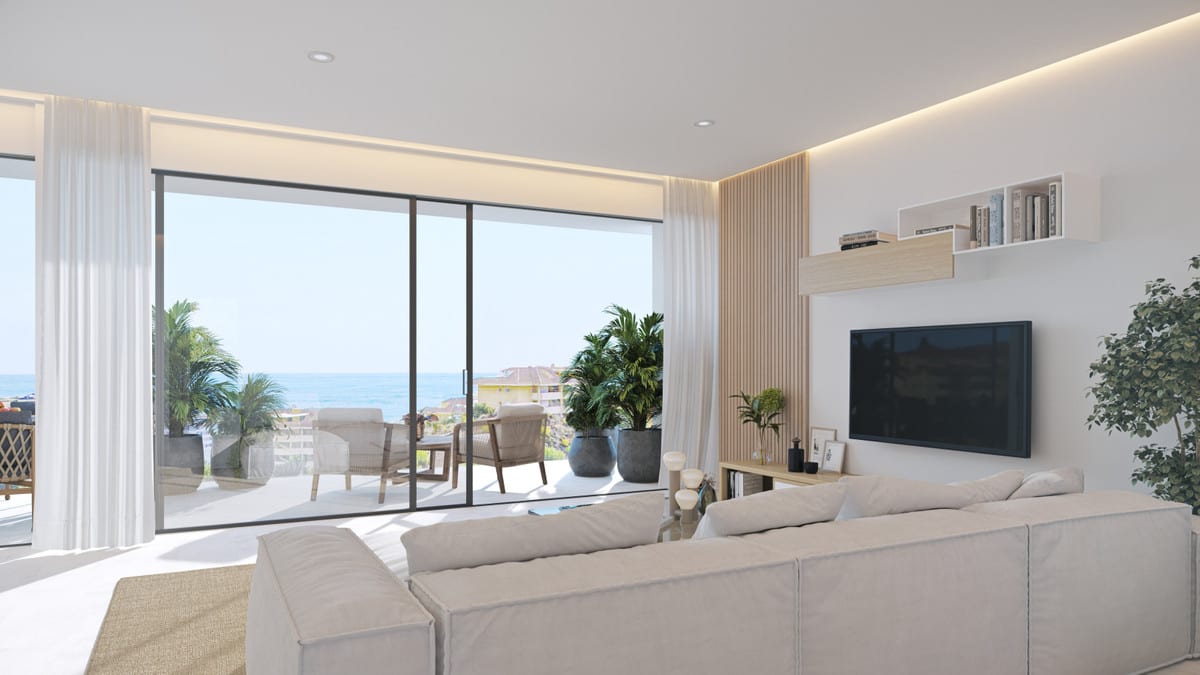 Project visualisation — THE KOS: Bright living room with a sofa, wood wall details and sliding doors to the terrace.