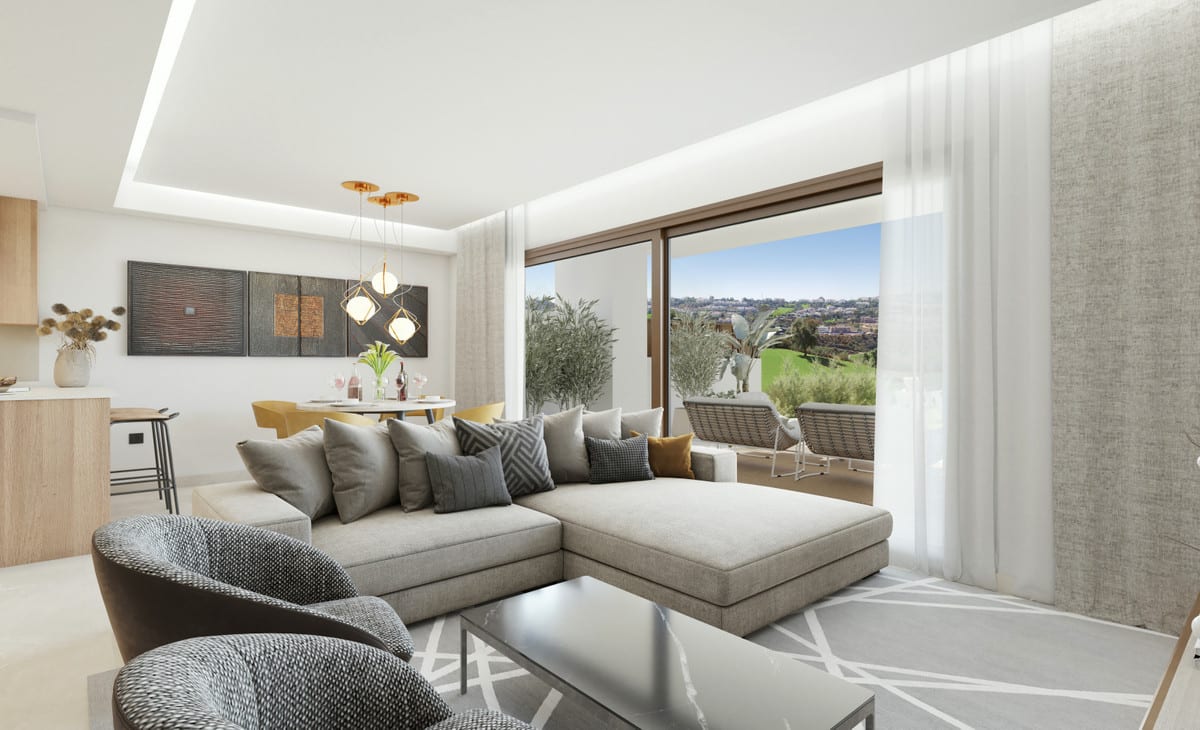 Rendered interior visualisation of THE MEADOWS with a light grey corner sofa, dark armchair, coffee table, round dining table with yellow chairs, gold pendant lights and wooden sliding doors opening onto the outside.