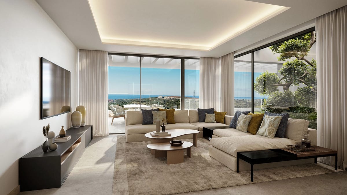 Rendered interior view of THE PLACE ALCAZABA with a beige corner sofa, coffee tables, television and floor-to-ceiling sliding doors.