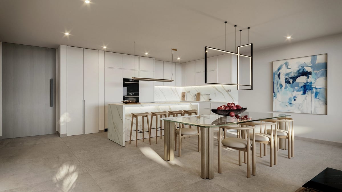 Rendered kitchen view of THE PLACE ALCAZABA with a marble-effect kitchen island, tall white cabinets, glass dining table and pendant lights.